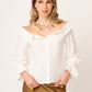 BLUSA CAMISERA CON ESCOTE BARDOT HOMBROS DESCUBIERTOS  Y BOTONES MANGA LARGA SORBONA