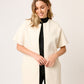 ABRIGO SEMI LARGO MINIMALISTA DE PAÑO COLOR IVORY CON BOLSILLOS TIPO CANGURO RIVOLI