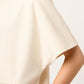ABRIGO SEMI LARGO MINIMALISTA DE PAÑO COLOR IVORY CON BOLSILLOS TIPO CANGURO RIVOLI